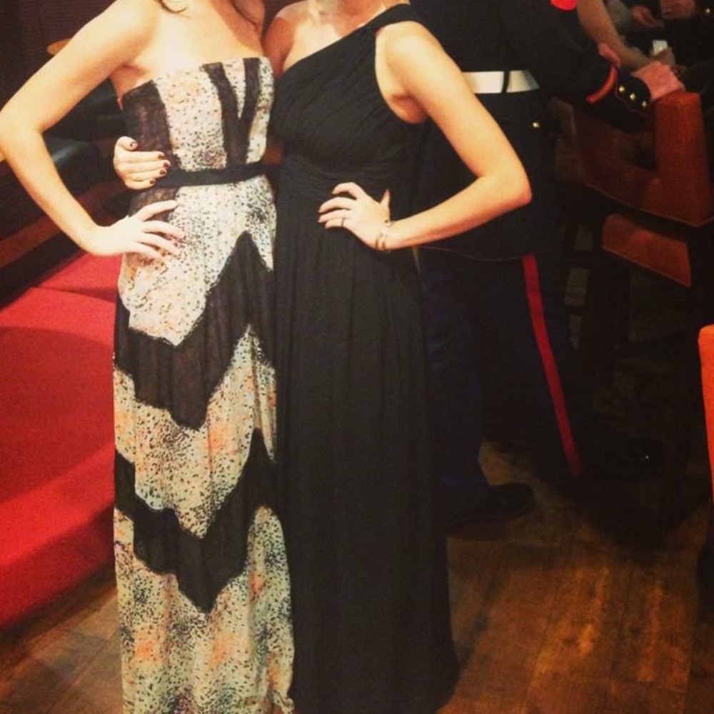 Black one shoulder floor length gown.